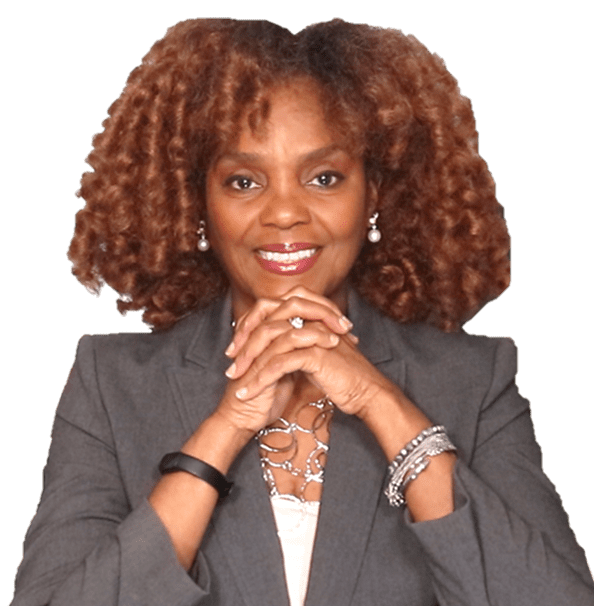 A woman with curly hair is smiling for the camera.